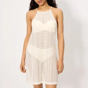 Vestido curto marfim com detalhes vazados e alças.